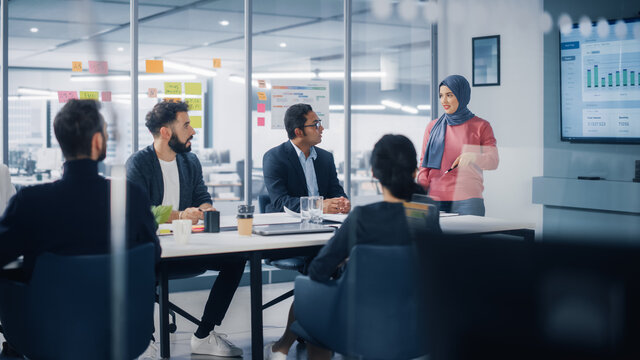 A project team reviewing plans together in a conference room