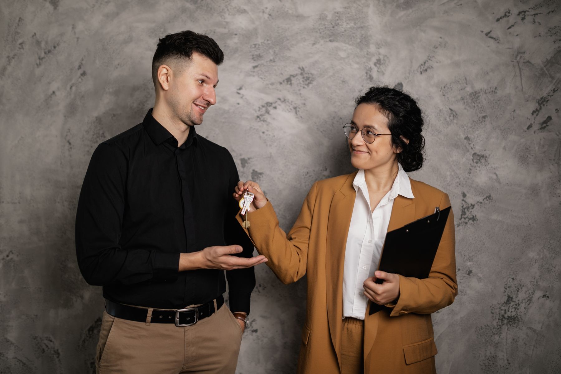 A guest receiving the keys to a furnished home