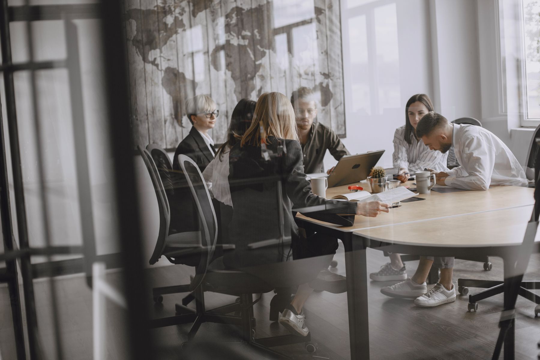 A professional team reviewing plans together around a table