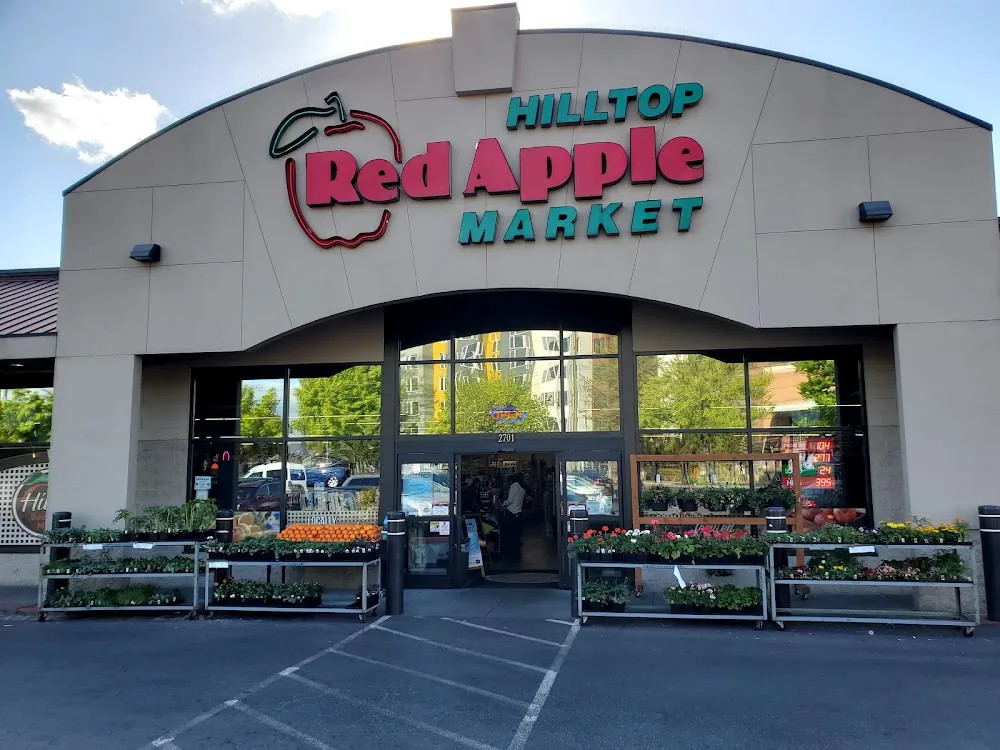 Hilltop Red Apple Market storefront with its sign and entrance at 2701 Beacon Ave S.