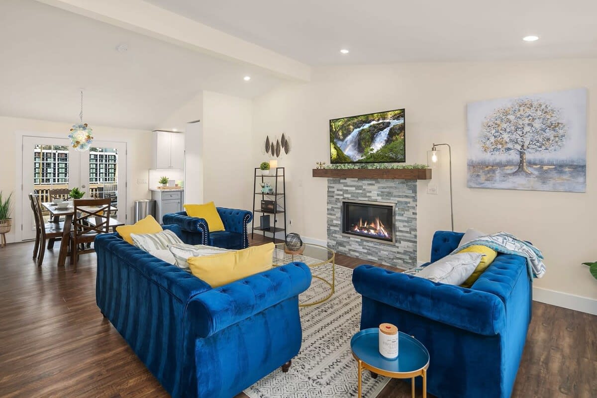 Living room and dining area with fireplace