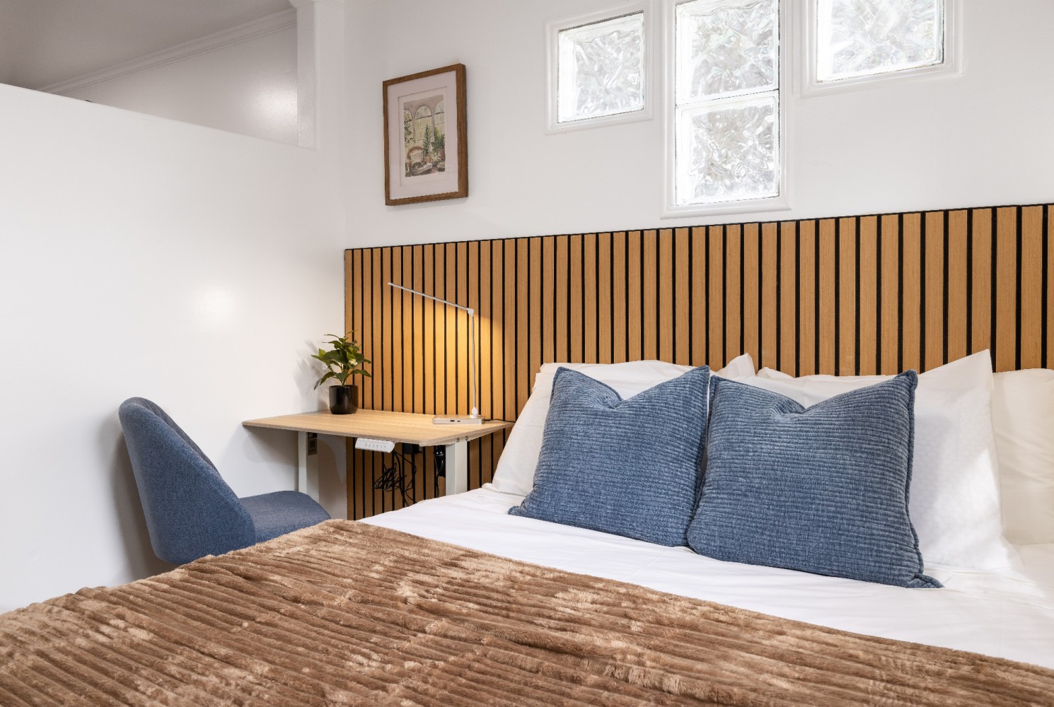 Separate bedroom and workspace in the Secret Garden suite